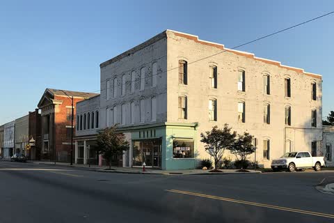 Two- and three-story brick commercial buildings along a downtown street in Ahoskie