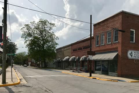 Brick commercial buildings at a street corner in downtown Aurora