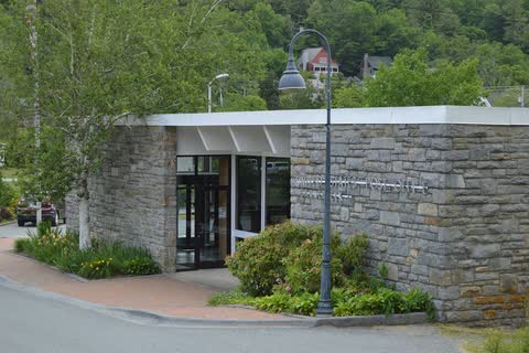 Stone-faced Banner Elk post office building with street lamps