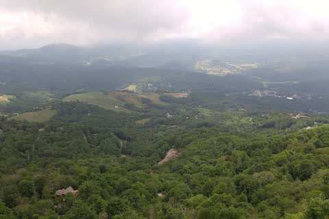 Wide view of forested mountain valleys from Beech Mountain