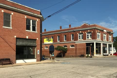 Two-story red-brick commercial buildings at a corner in downtown Bladenboro