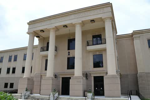 A tan classical-style courthouse with tall columns at the Brunswick County Government Center