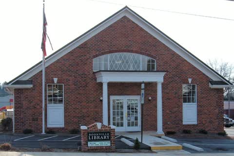 Brick library building with a white columned entrance in Boonville