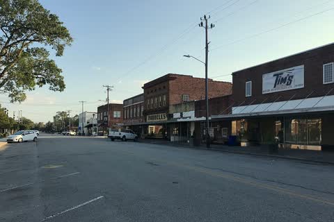 One- and two-story brick storefronts along a street in downtown Burgaw