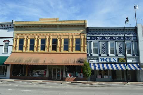 Ornate 19th-century commercial storefronts with decorative cornices in downtown Clinton