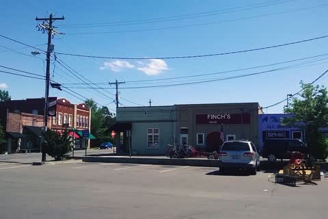 Brick commercial buildings at a downtown intersection in Creedmoor