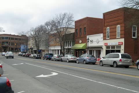 Brick storefronts and angled parking along Main Street in Davidson