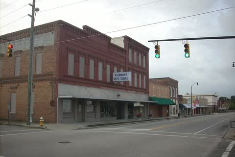 Corner of Main Street in Fairmont with a two-story brick commercial block