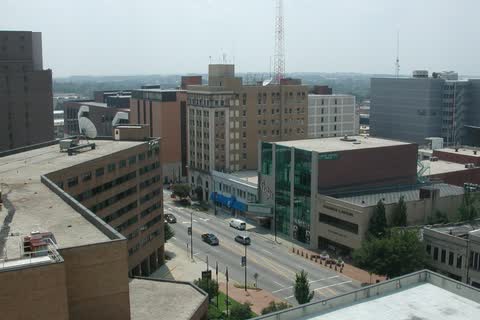 Elevated view over downtown High Point streets, office buildings and a radio mast