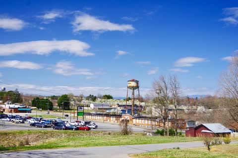 Wide view of Hildebran with its water tower and buildings under a blue sky