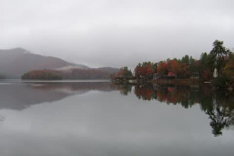 Calm Lake Santeetlah reflecting autumn trees and hills