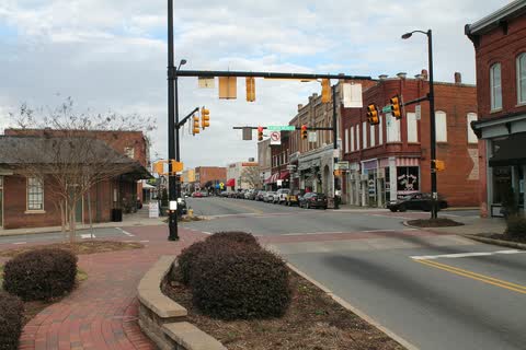 Brick storefronts and traffic signals along Main Street in downtown Mooresville