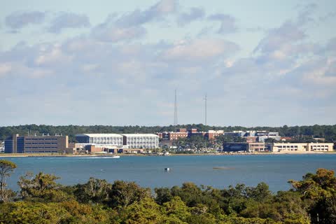 Morehead City's waterfront buildings seen across the water from Atlantic Beach