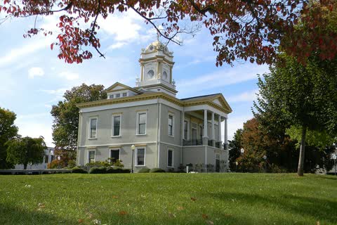 Historic Burke County Courthouse with its clock cupola, framed by autumn trees