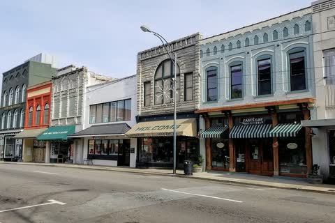 Row of historic commercial buildings with awnings along North Main Street in Mount Airy