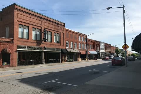 Two- and three-story brick commercial buildings along a downtown street in North Wilkesboro