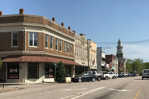 Two- and three-story brick commercial buildings along a downtown street in Oxford