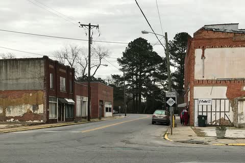 Older brick commercial buildings at an intersection in Rich Square