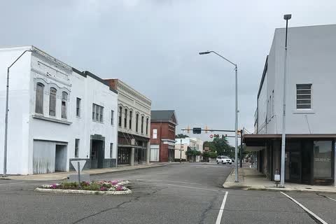 White and brick commercial buildings on Washington Street in downtown Rockingham