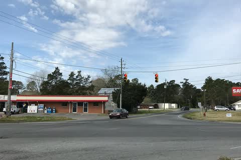 A crossroads with small commercial buildings in Rose Hill