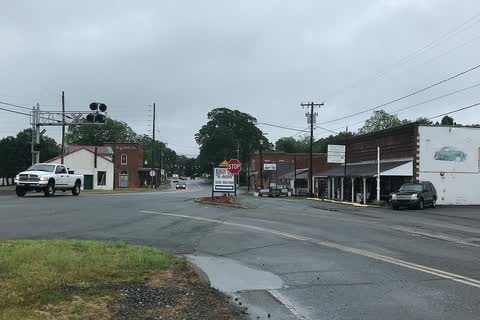 Small-town street corner in Rural Hall with low commercial buildings