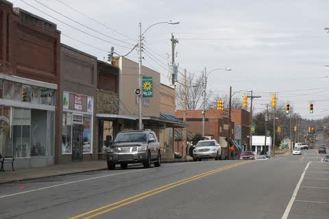 North Chatham Avenue in Siler City with brick storefronts and traffic lights