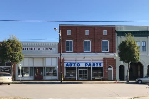 Two-story brick commercial buildings along a downtown street in Spring Hope