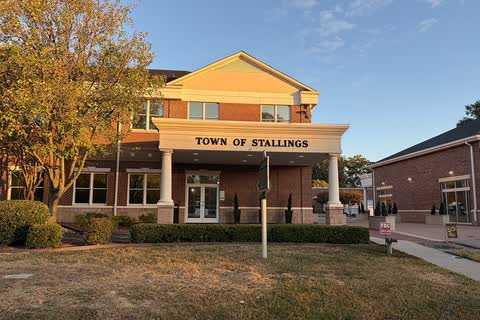 Two-story town hall building with a sign reading Town of Stallings