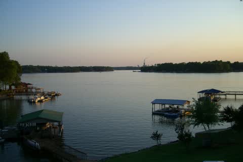 Calm water of Lake Norman with boat docks at dusk, seen from Troutman