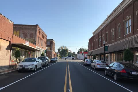 Two-story brick storefronts along a downtown street in Weldon
