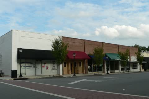 A row of storefronts with awnings along North Main Street in Wendell