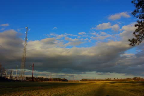 An open field under a blue sky with clouds in Winfall