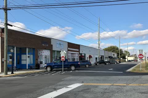 One-story storefronts along a street in Winterville