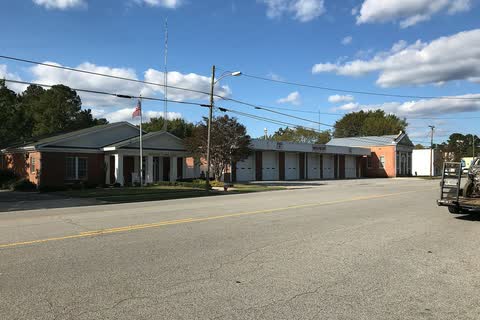 Low commercial buildings along a wide street in Winton