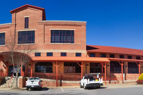 Brick 1916 power company building with arched windows in Woodfin
